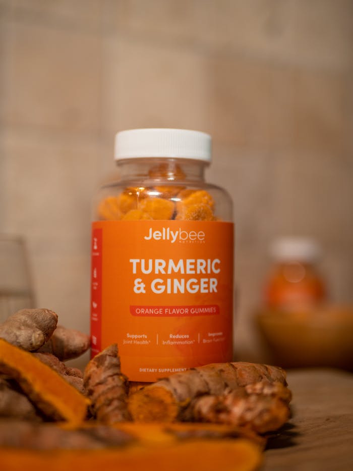 Close-up of Jellybee turmeric and ginger orange flavor gummies for health and nutrition.